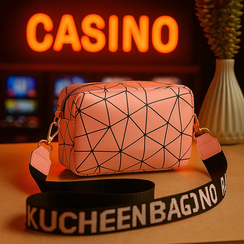 Geometric patterned handbag with 'KUCHEEN BAGNO' strap in front of a neon 'CASINO' sign.